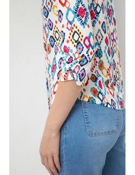 Camisa Pastora de Tinta & Bariloche - Plano corto de la parte posterior y la manga remangada.